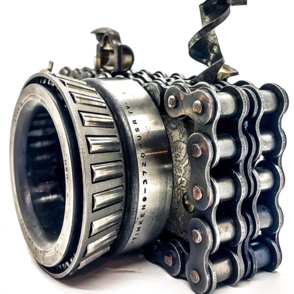 A Camera with a chain attached to it.