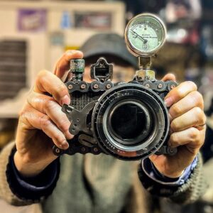 A vintage camera held by a person