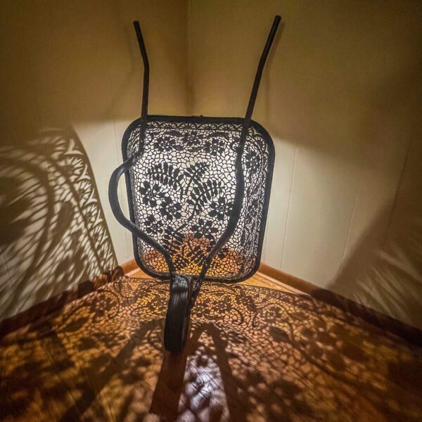 A table lamp with a lace pattern on it.