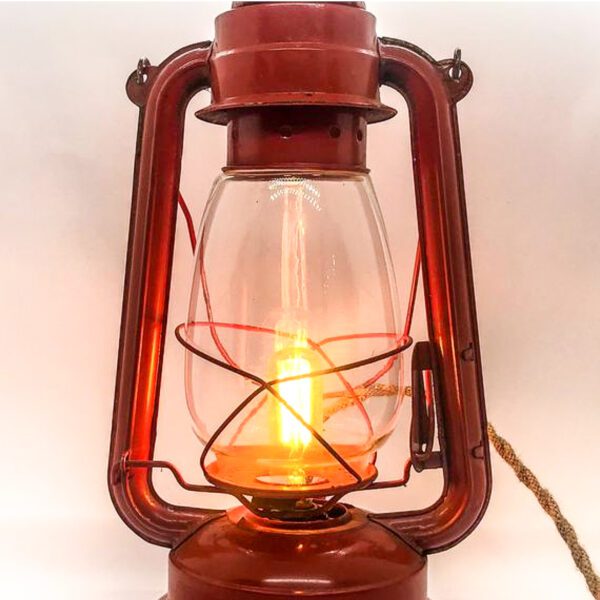A Vintage Lantern converted to Desk Lamp with a candle inside.
