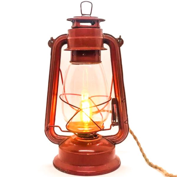 A Vintage Lantern converted to Desk Lamp with a rope attached to it.