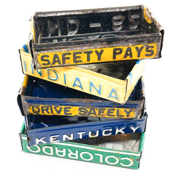 Vintage License Plate Valet Tray stacked on top of each other.
