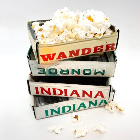 A stack of Vintage License Plate Valet Trays with the words wander and indiana.