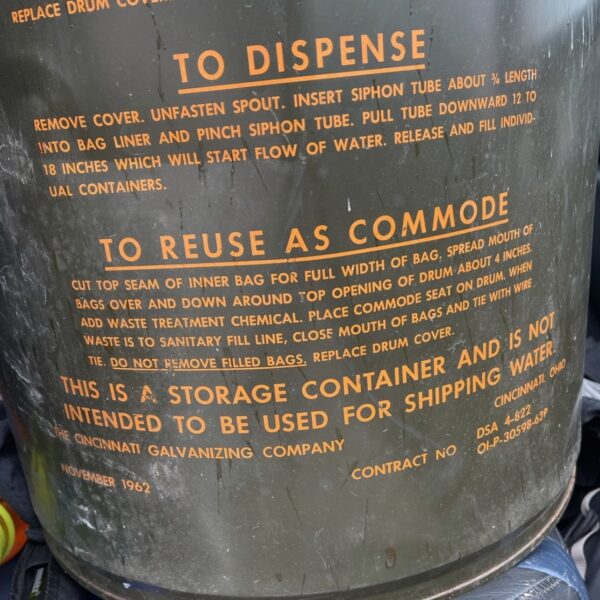 A container with a sign that says to dispose as Plasma cut coffee-side table.